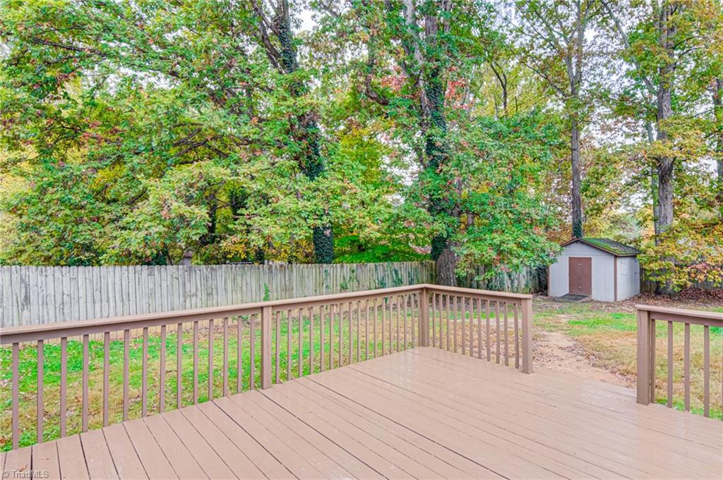 1145 Tabor Street High Point, NC 27262 - Photo 22 of 24 Enjoy the beautiful NC weather on this wonderful deck. Notice the storage building and privacy fence!
