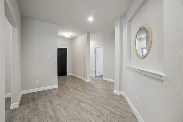 a view of entryway with wooden floor
