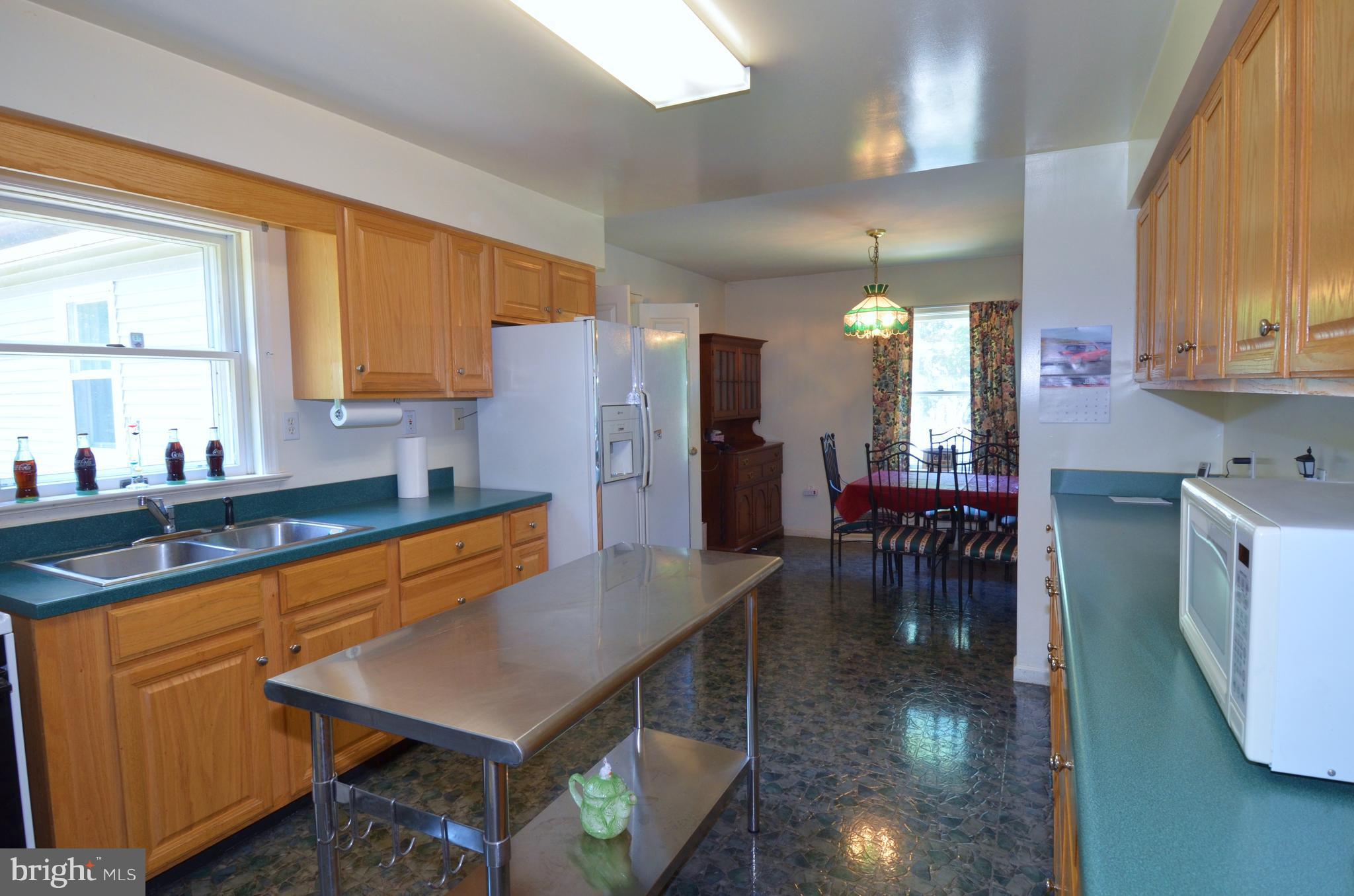 764 Summit Point Road Summit Point, WV 25446 - Photo 5 of 23 Alternate view of kitchen to dining space.