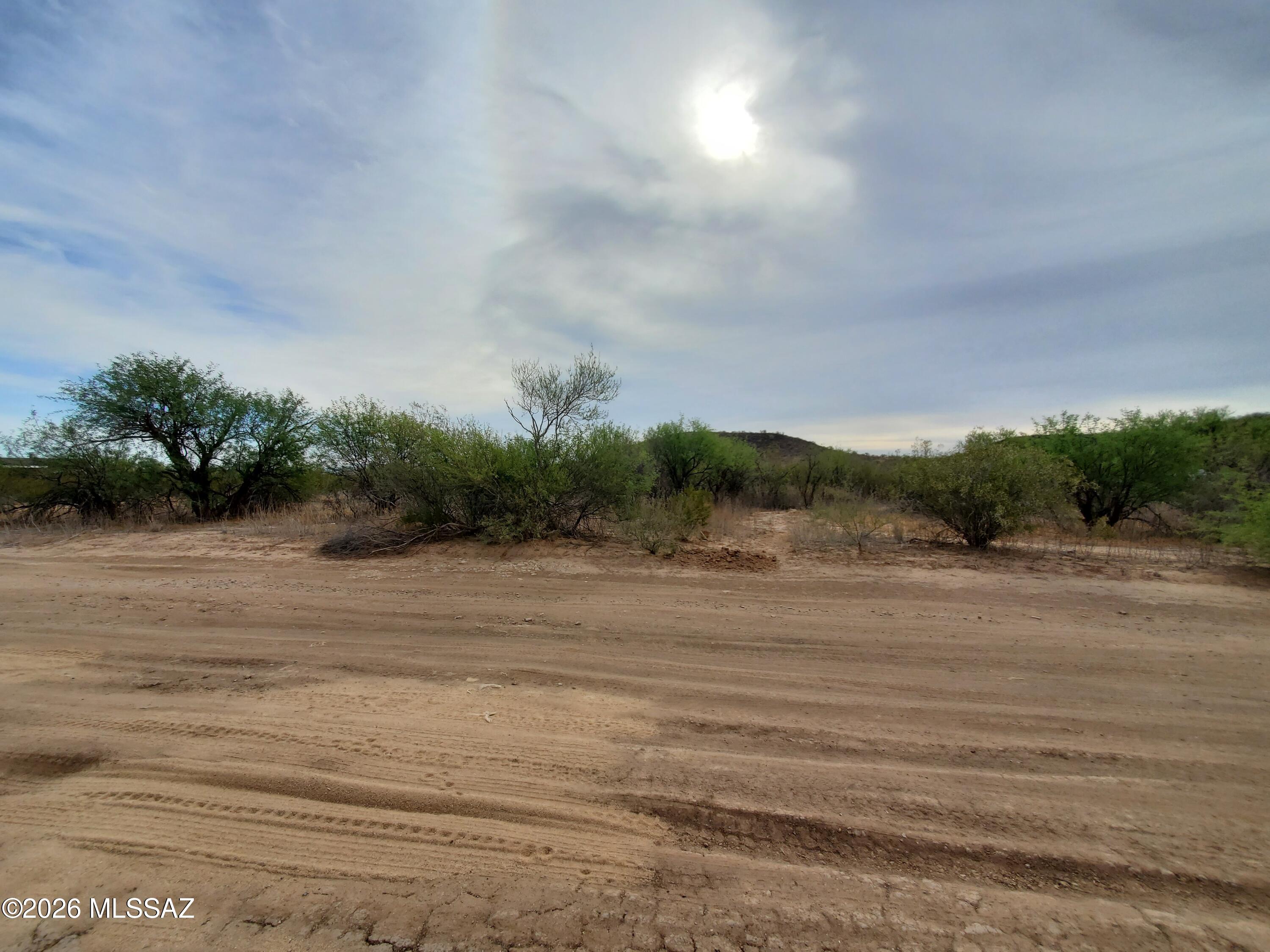 7925 South Worden Road Tucson, AZ 85735 - Photo 19 of 20 a view of a lake and a yard