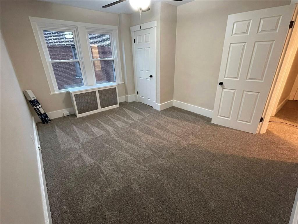 863 5th Avenue, Unit 2 Coraopolis, PA 15108 - Photo 13 of 17 an empty room with windows
