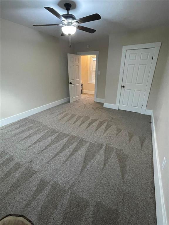 863 5th Avenue, Unit 2 Coraopolis, PA 15108 - Photo 14 of 17 an empty room with fan and windows