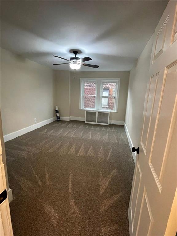 863 5th Avenue, Unit 2 Coraopolis, PA 15108 - Photo 15 of 17 an empty room with windows and fan