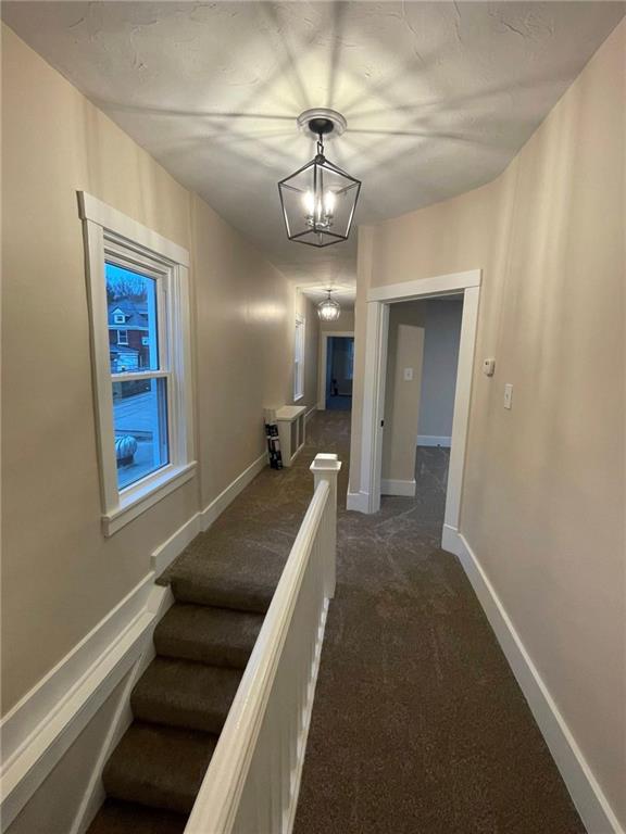 863 5th Avenue, Unit 2 Coraopolis, PA 15108 - Photo 4 of 17 a view of a hallway with a livingroom and furniture