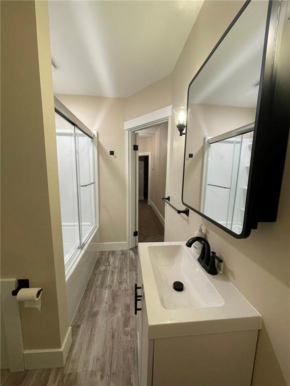 863 5th Avenue, Unit 2 Coraopolis, PA 15108 - Photo 10 of 17 a bathroom with a sink a mirror and shower