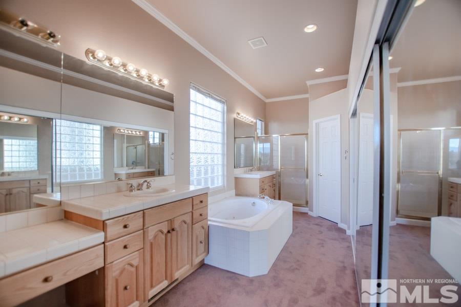 1815 Hunter Creek Road Reno, NV 89519 - Photo 17 of 25 a kitchen with a sink and a large mirror