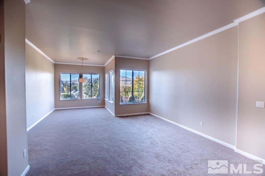 1815 Hunter Creek Road Reno, NV 89519 - Photo 5 of 25 a view of an empty room with a window