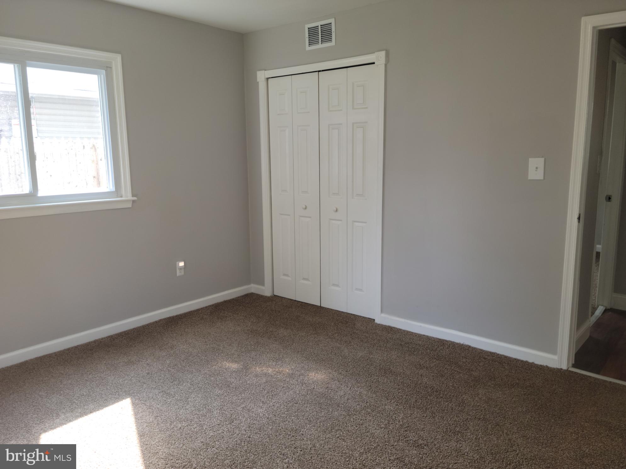 169 Sunset Road Willingboro, NJ 08046 - Photo 14 of 26 an empty room with windows and closet