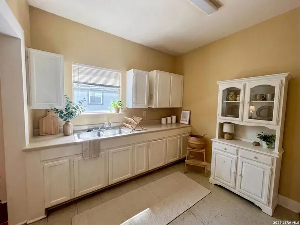 a kitchen with a sink and cabinets