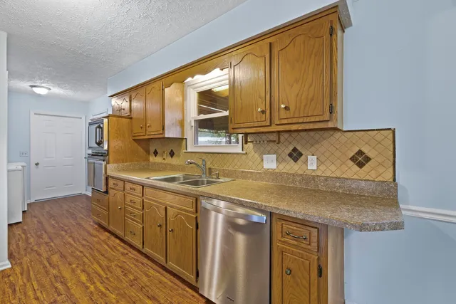 a kitchen with a sink and cabinets