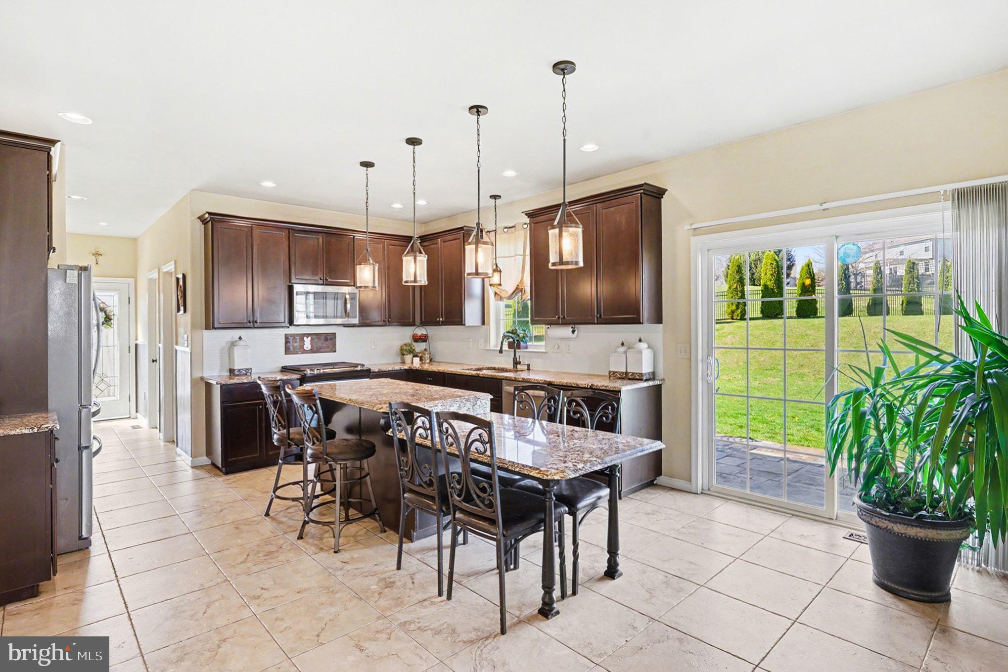 76 Gehringer Road Barto, PA 19504 - Photo 3 of 46 a kitchen with a table chairs and entryway