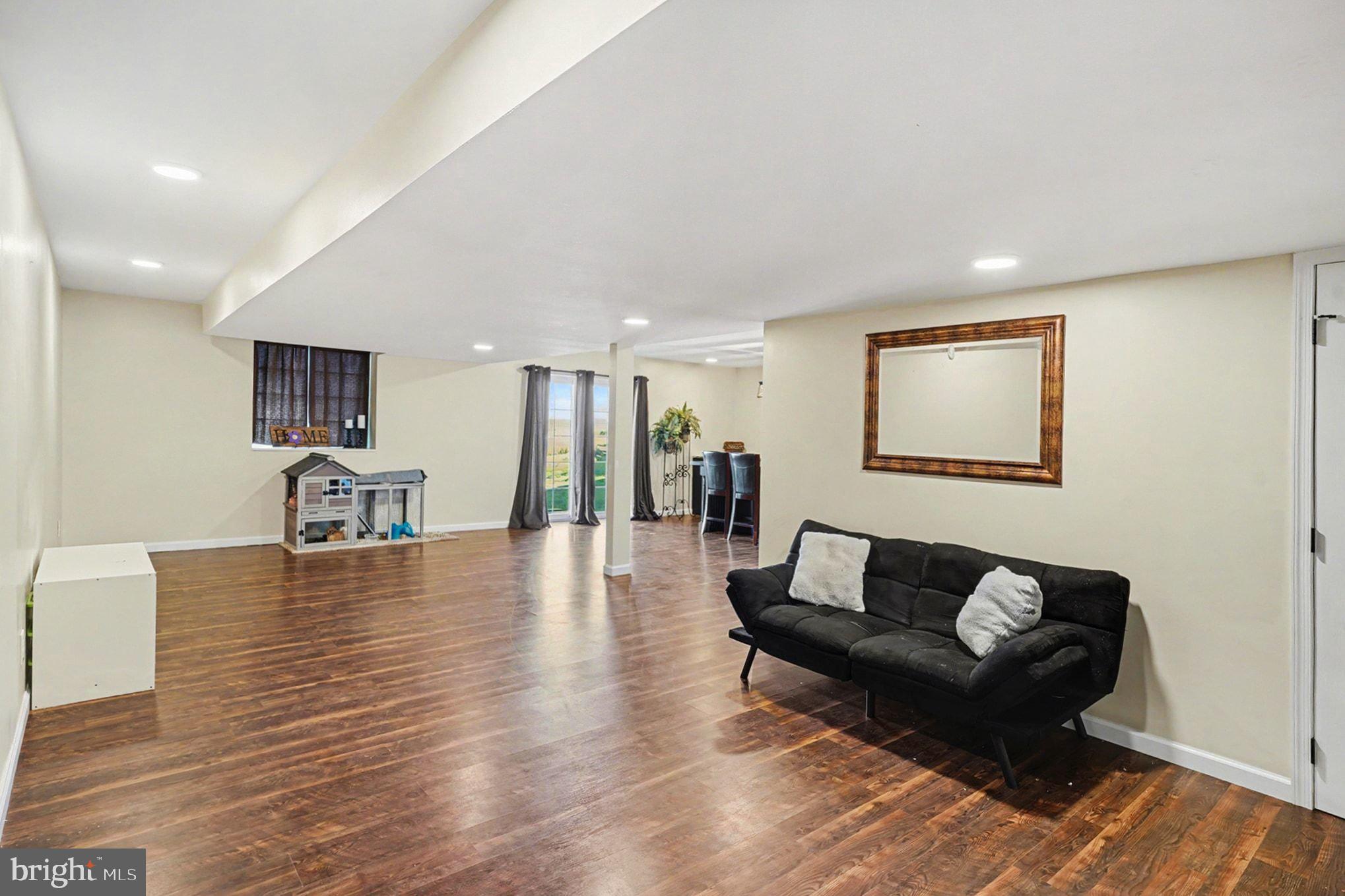 76 Gehringer Road Barto, PA 19504 - Photo 35 of 46 a living room with furniture and a wooden floor