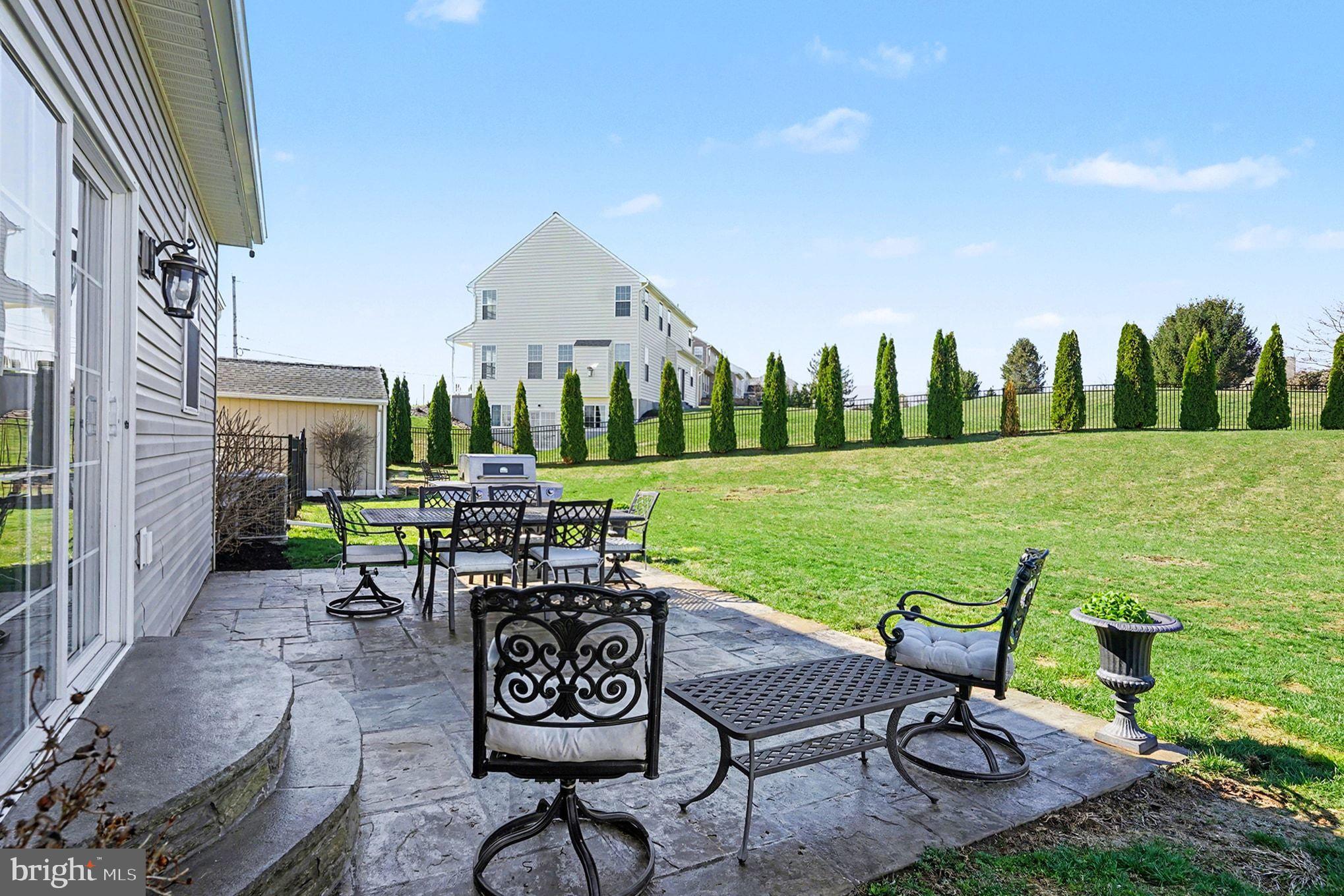 76 Gehringer Road Barto, PA 19504 - Photo 40 of 46 a view of a patio with table and chairs and potted plants with wooden floor and fence