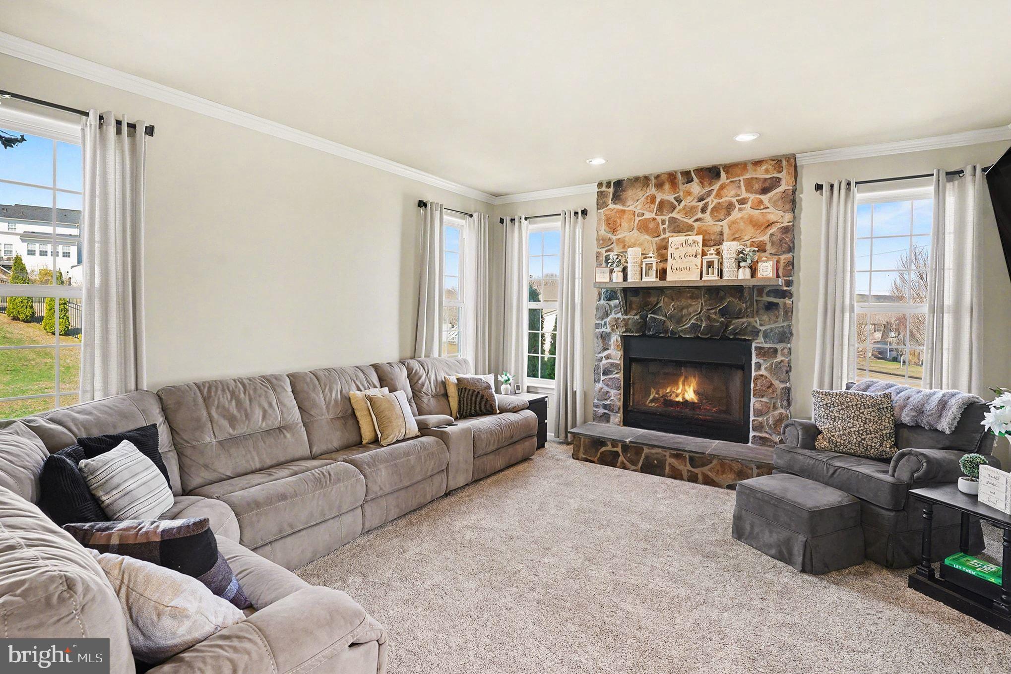 76 Gehringer Road Barto, PA 19504 - Photo 7 of 46 a living room with furniture a flat screen tv and a fireplace