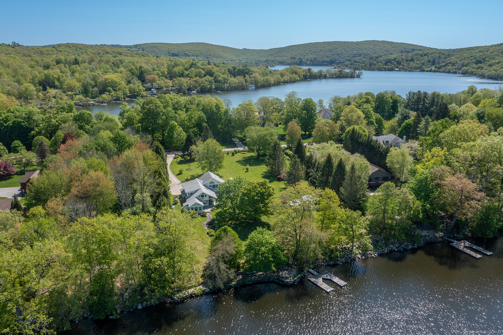 18 Arrow Point Road Warren, CT 06777 - Photo 1 of 30 an aerial view of green landscape with trees houses and lake view