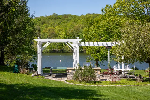 a view of an entryway with wooden floor and stairs