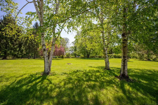 a living room with furniture fireplace and flat screen tv