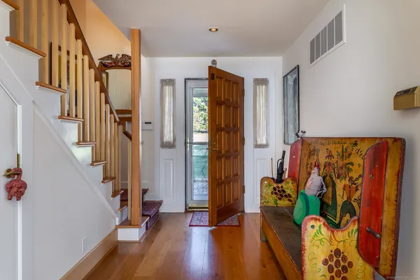 a living room with furniture and large windows
