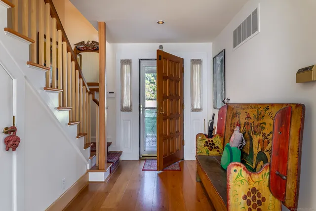 a living room with furniture and large windows