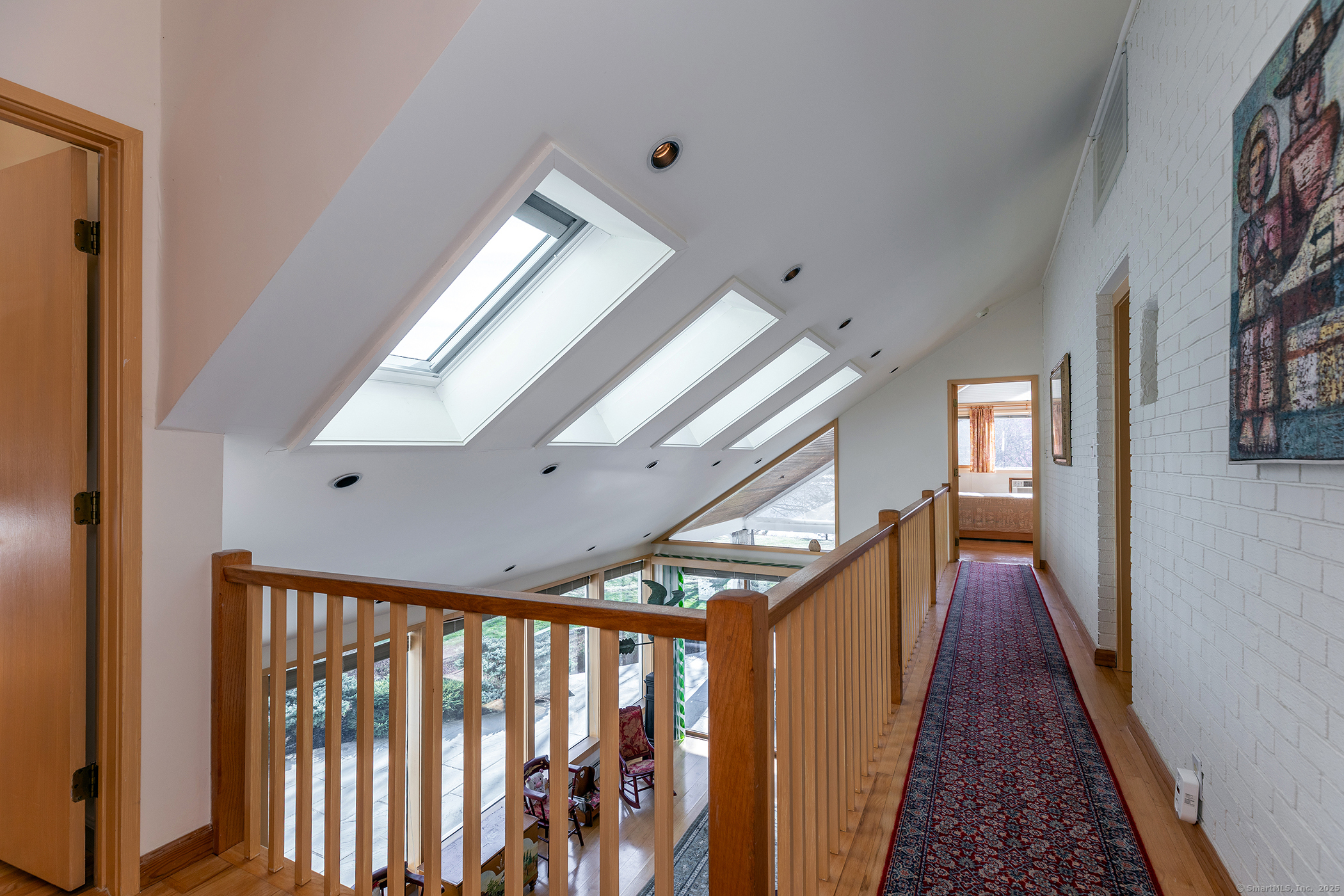 18 Arrow Point Road Warren, CT 06777 - Photo 20 of 30 a view of a hallway with wooden floor and stairs