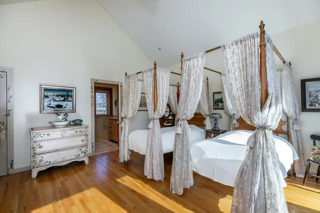 a bedroom with furniture and a window