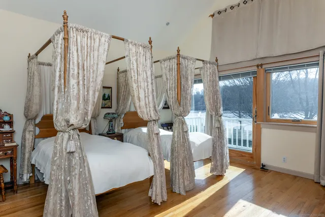 a bedroom with bed and window