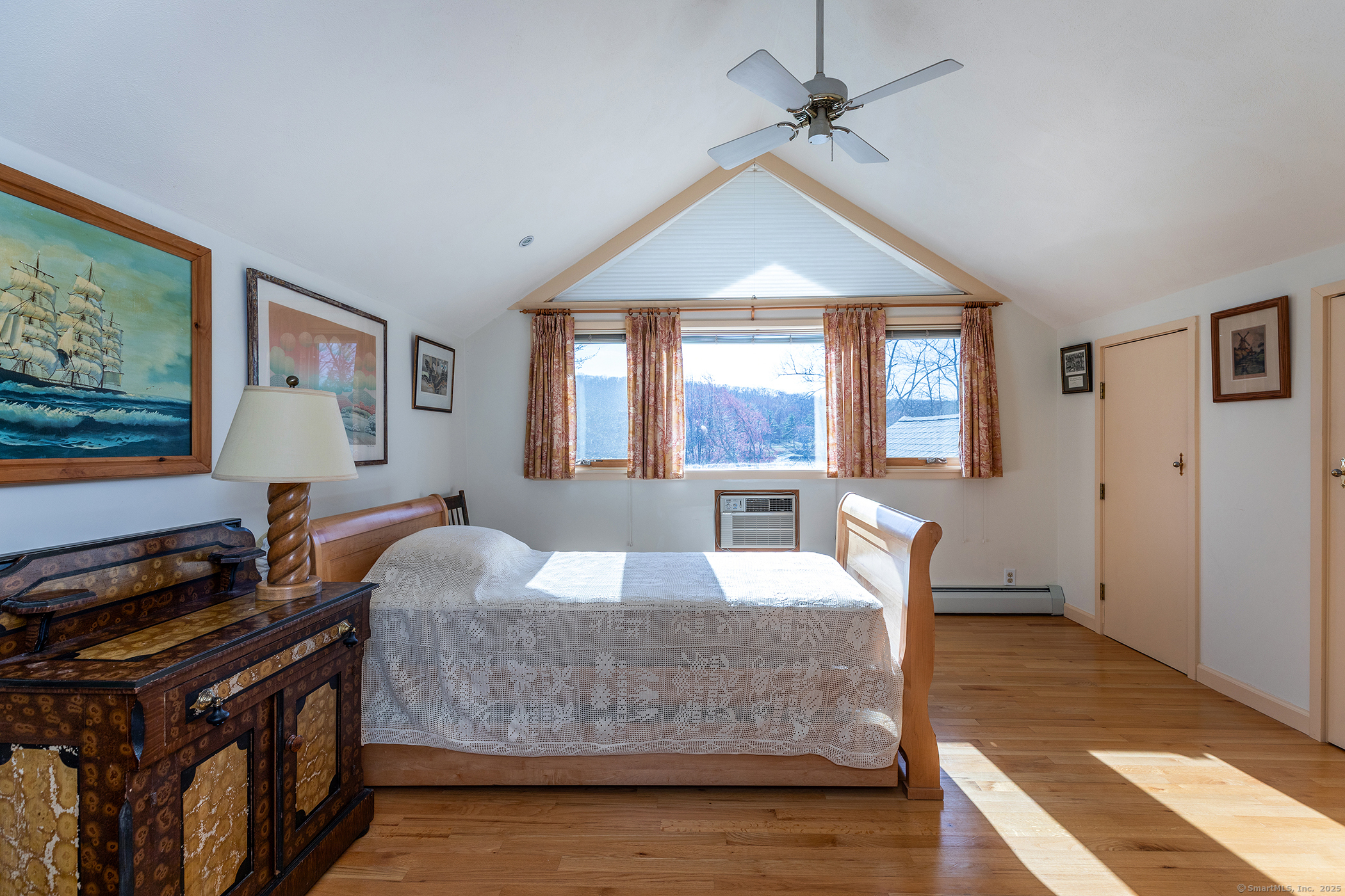18 Arrow Point Road Warren, CT 06777 - Photo 25 of 30 a bedroom with a bed and a flat tv screen on the dresser