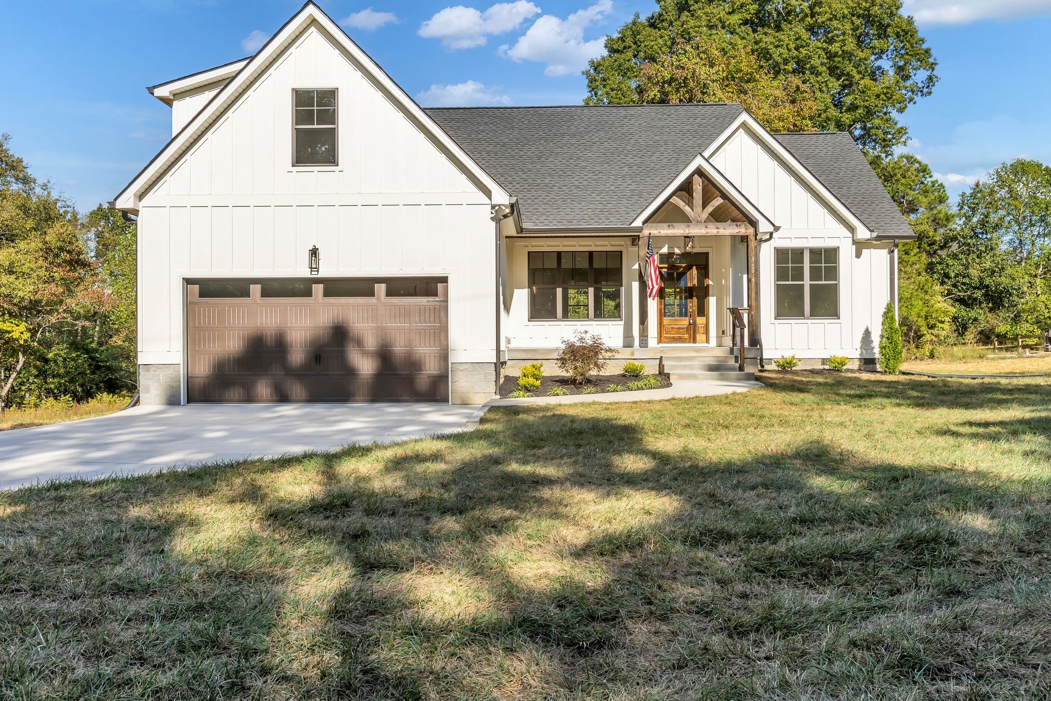 a front view of a house with a yard