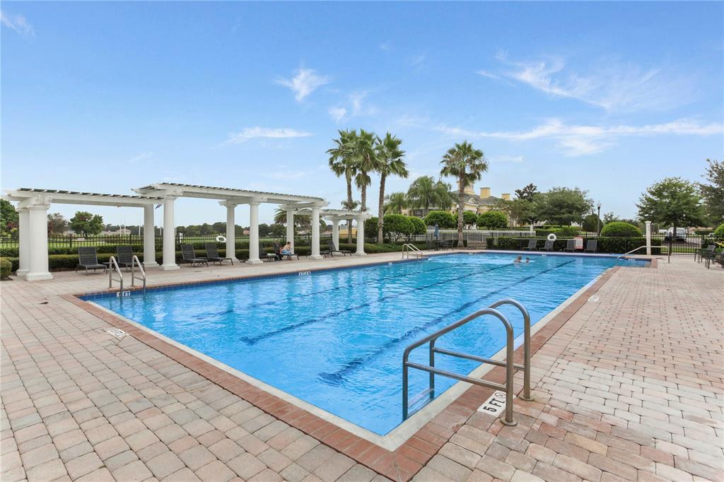 4111 Eastminster Road Davenport, FL 33837 - Photo 4 of 18 a view of a swimming pool with a lounge chair
