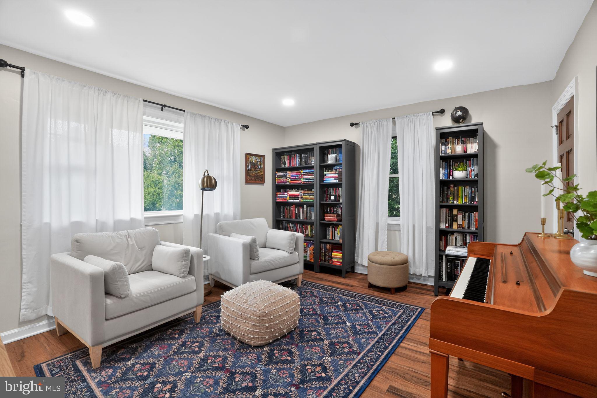 516 Church Road Norristown, PA 19403 - Photo 21 of 31 a living room with furniture and a book shelf