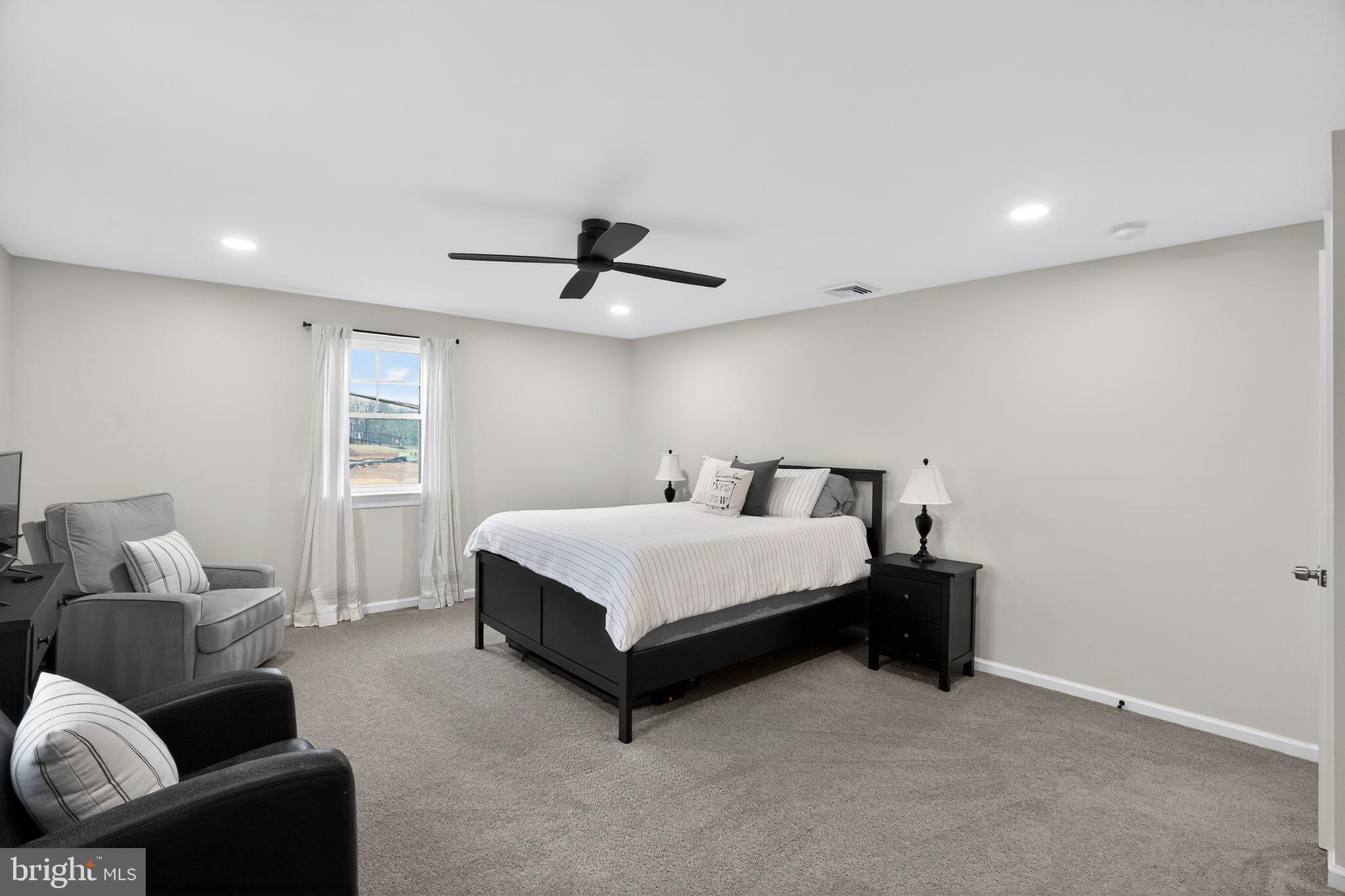 516 Church Road Norristown, PA 19403 - Photo 29 of 31 a bed room with a bed and a couch