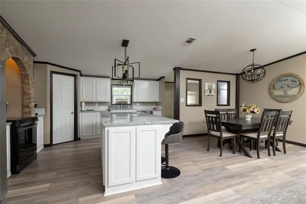 a view of a dining room kitchen and a window