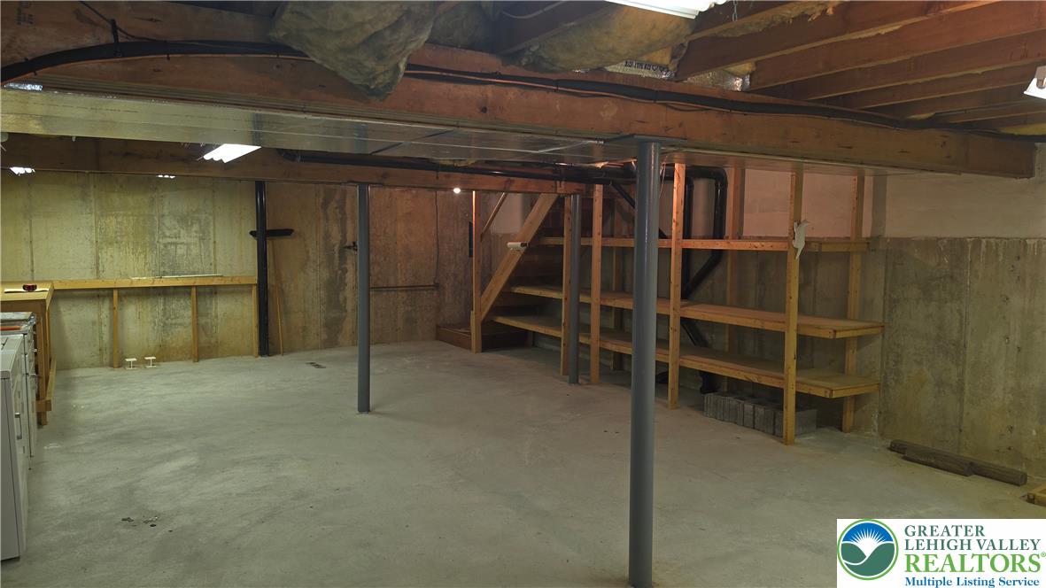 168 Springhouse Road Allentown, PA 18104 - Photo 41 of 49 A spacious, unfinished basement offers ample room for storage and future development.