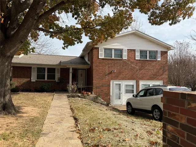 a view of a car parked in front of a house