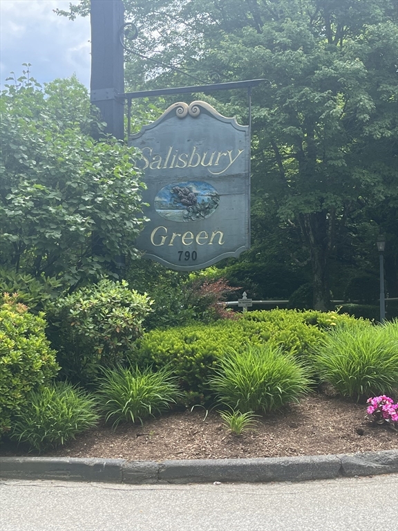 a sign that is sitting on a wooden wall