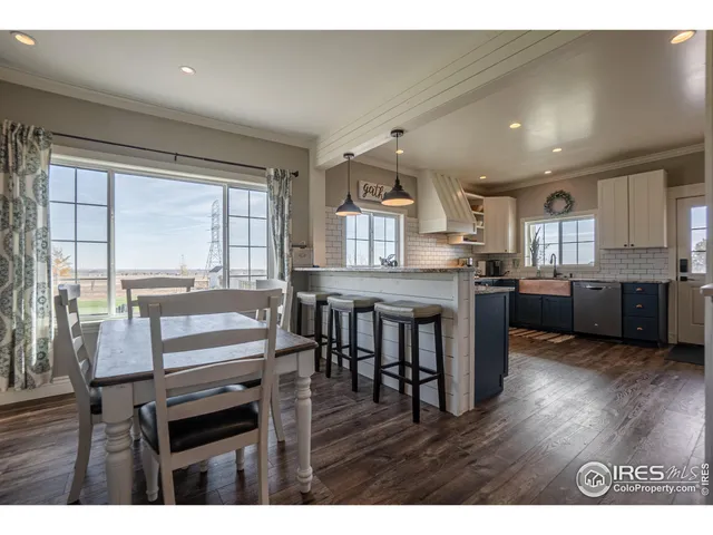 a kitchen with a table and chairs in it