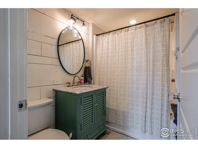 a view of a bathroom with a sink and mirror