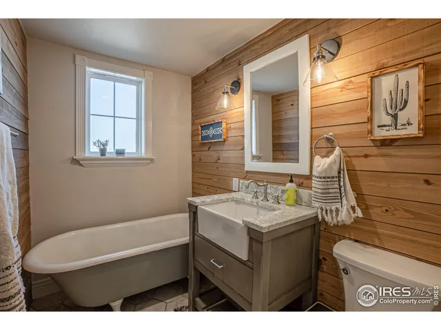 a bathroom with a sink toilet and tub