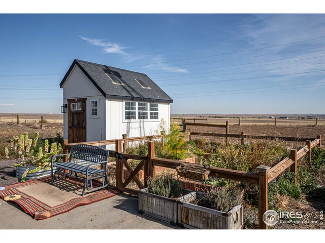 a view of a chairs and table in the patio