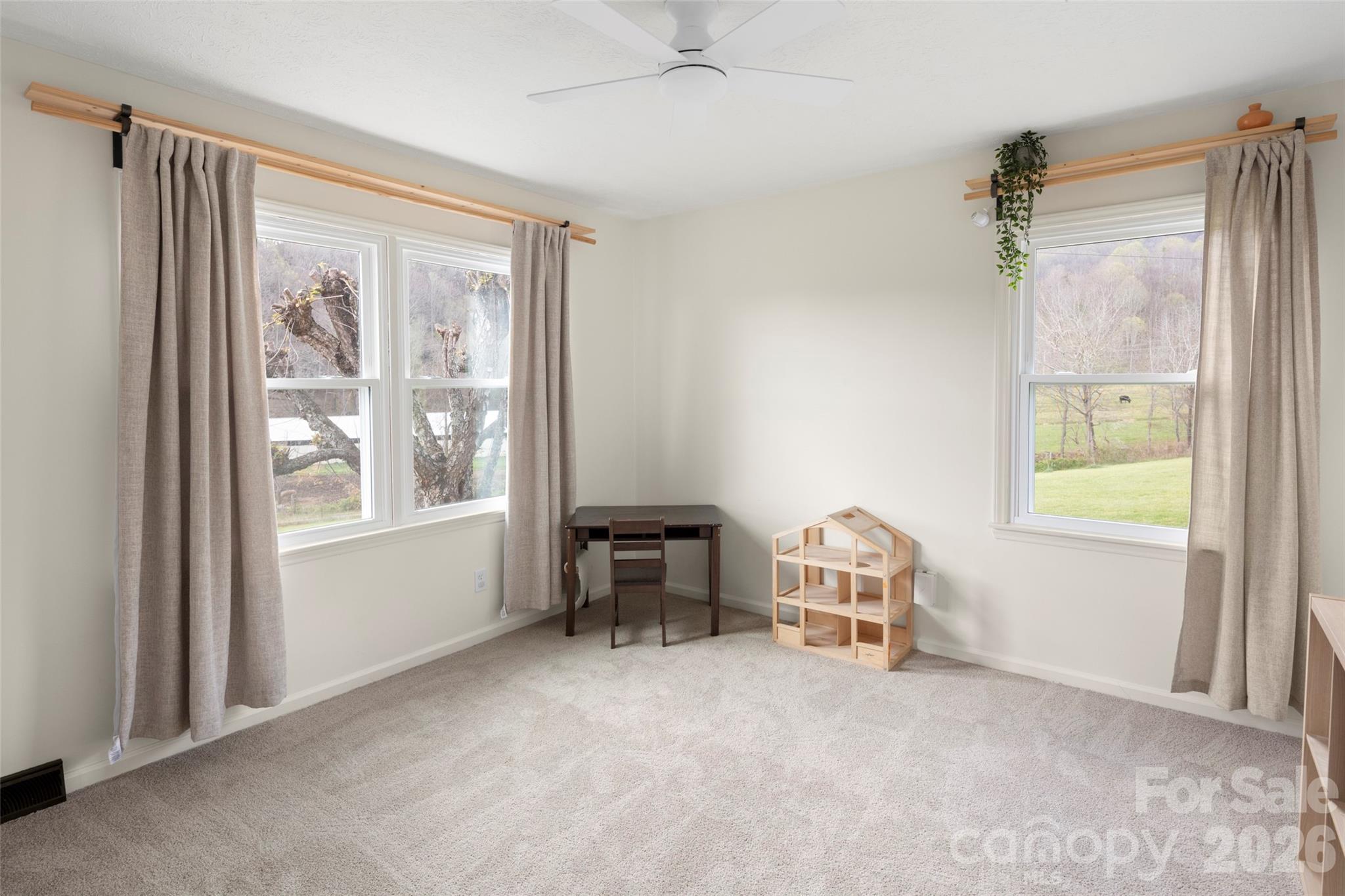 17 Boyd Cove Road Leicester, NC 28748 - Photo 21 of 40 a livingroom with a window and dining area