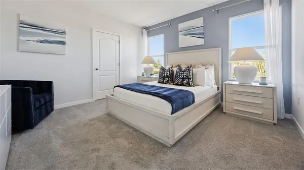 a bedroom with a bed and lamp
