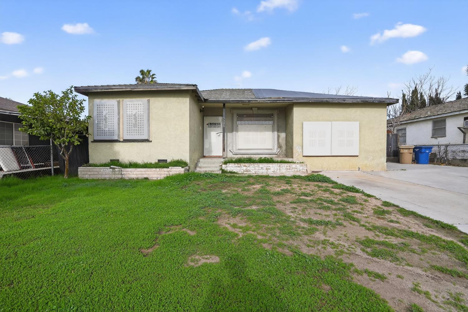 3306 Center Street Bakersfield, CA 93306 - Photo 1 of 1 a front view of a house with a yard
