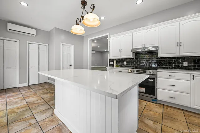 a kitchen with a sink cabinets and window