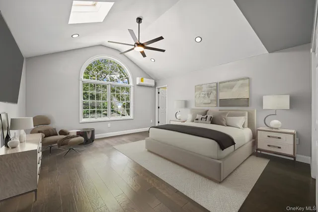 a spacious bedroom with a bed and a chandelier