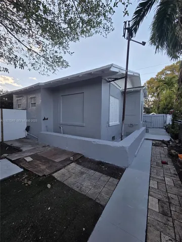 a view of a backyard of the house
