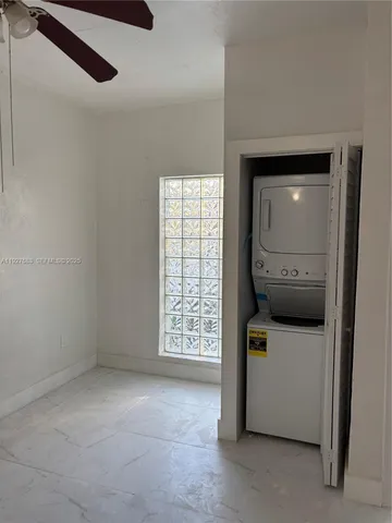 a view of hallway with washer and dryer