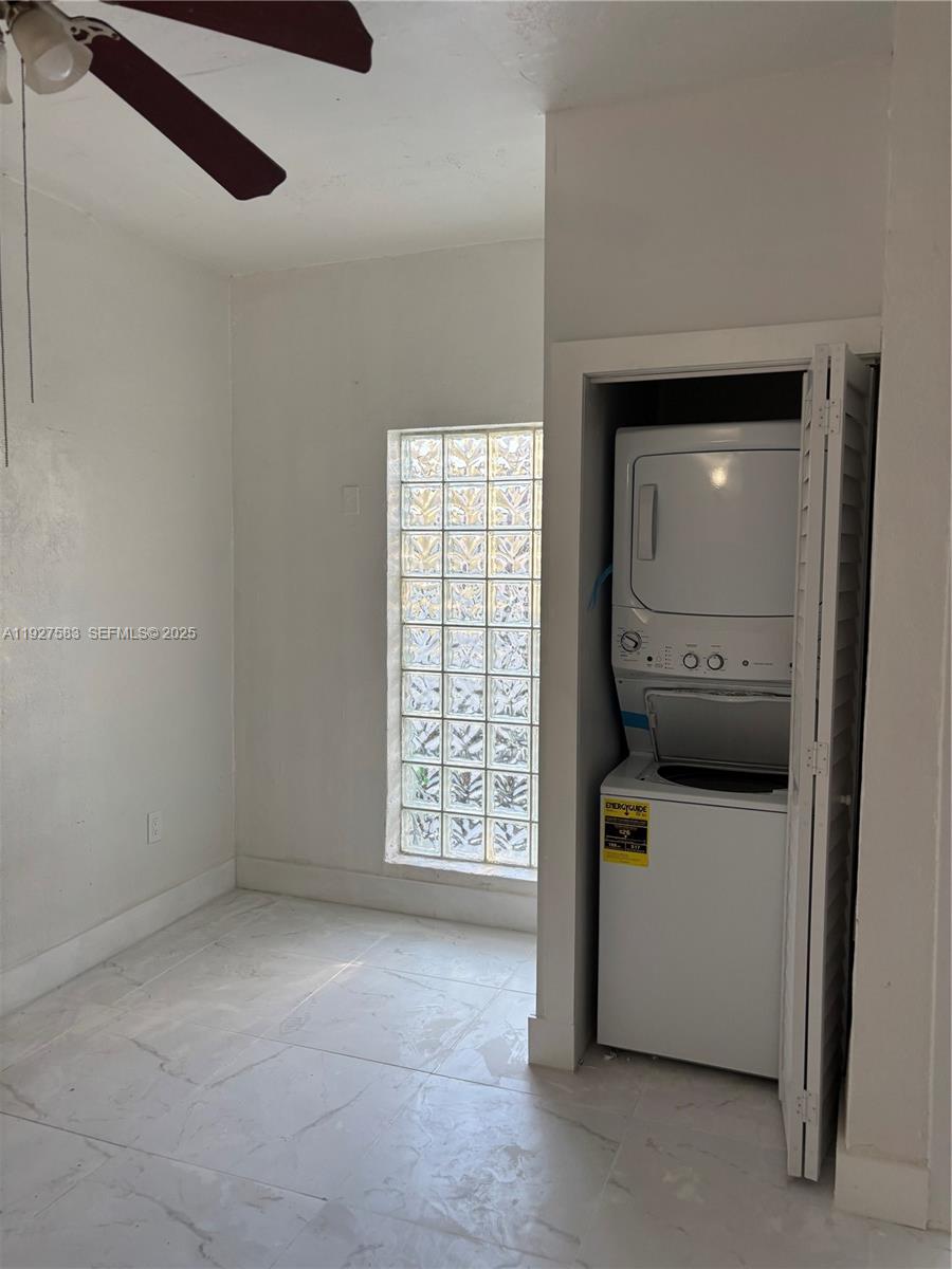 568 Southwest 3rd Street, Unit LEFT 566 Miami, FL 33130 - Photo 3 of 17 a view of hallway with washer and dryer