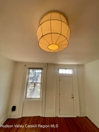 a view of a patio with a table and chairs