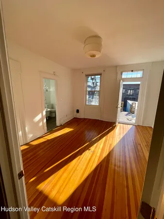 a kitchen with a stove and white cabinets