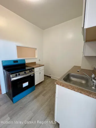a bathroom with a toilet a sink and bathtub